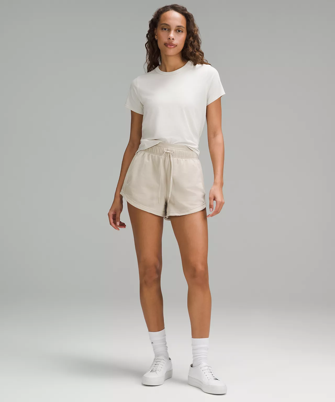 Model with Lululemon Inner Glow High-Rise French Terry Short 3 inch